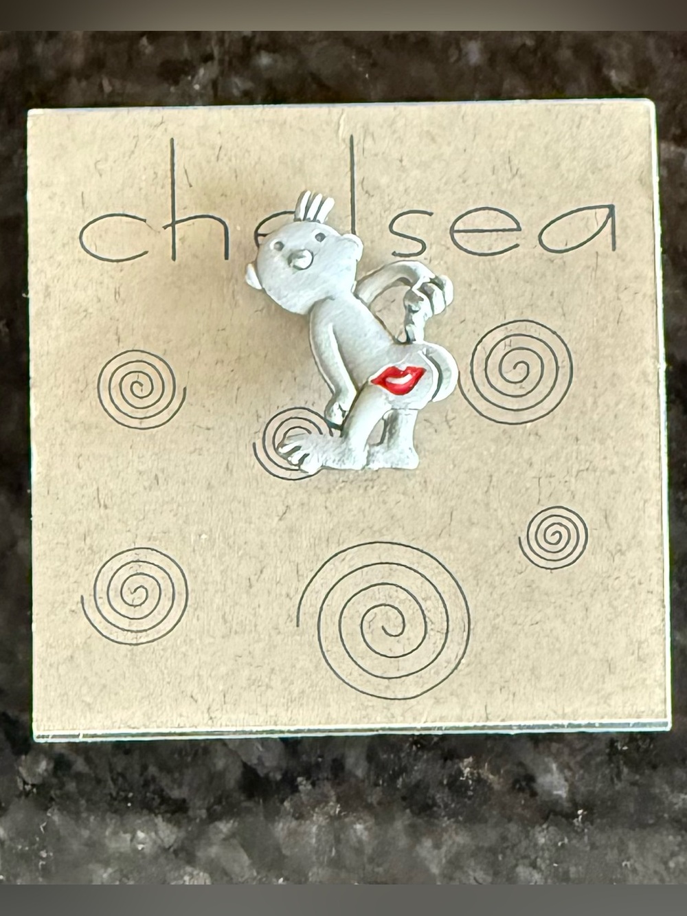A Cute Vintage Pewter Pin features a Cheeky Figure with Red 💋 on the Backside